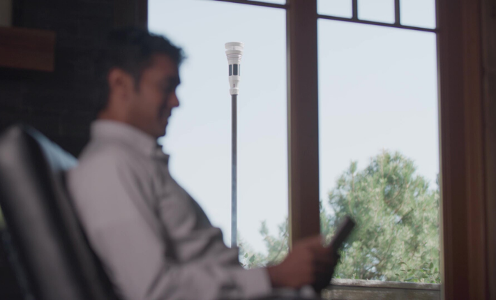 man in smart home reading a tablet