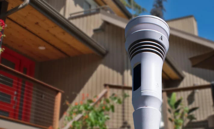 the Tempest Weather System in a backyard of a home