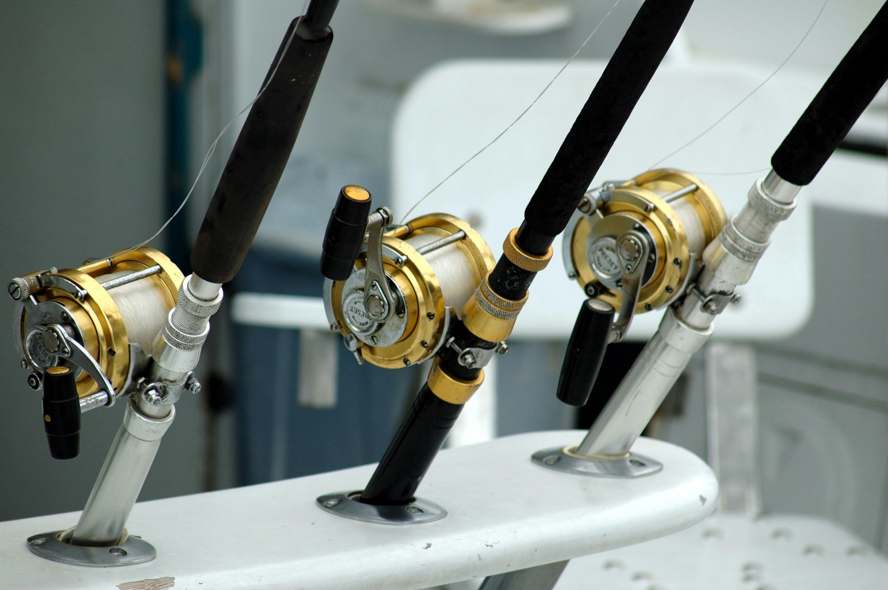 three fishing rods on a boat