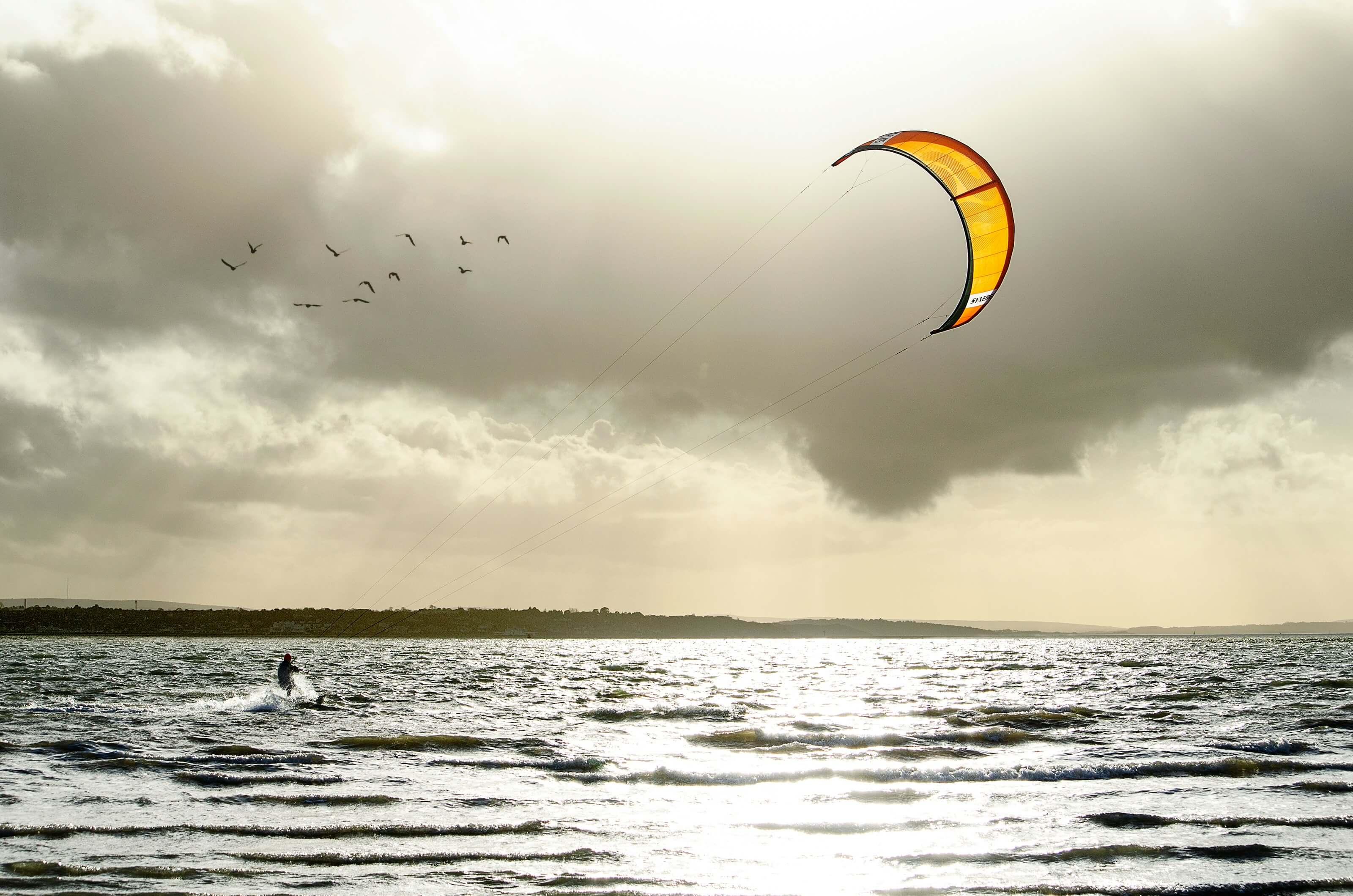 a kiteboarder kiteboarding on a lake