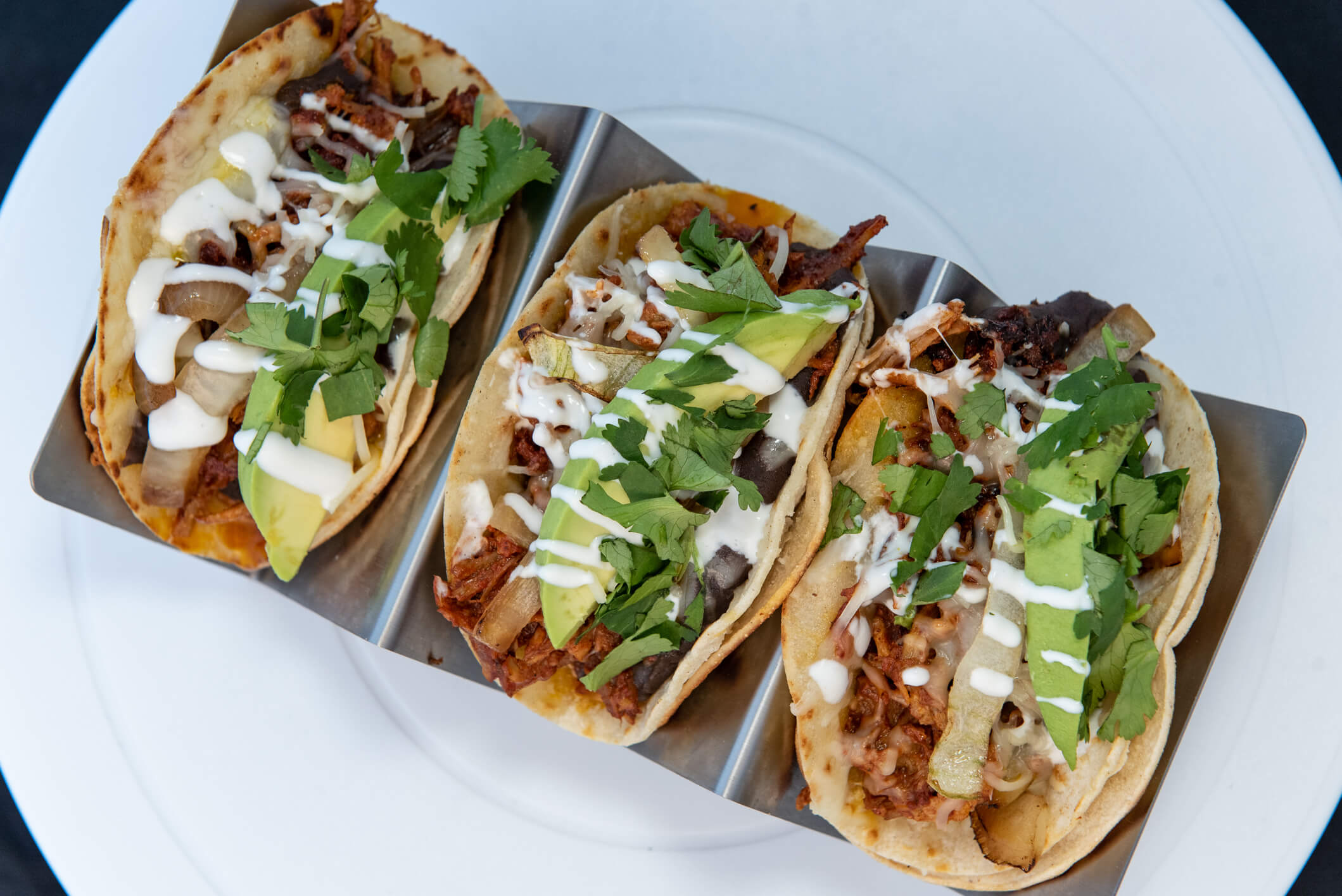 three tacos at a backyard taco night